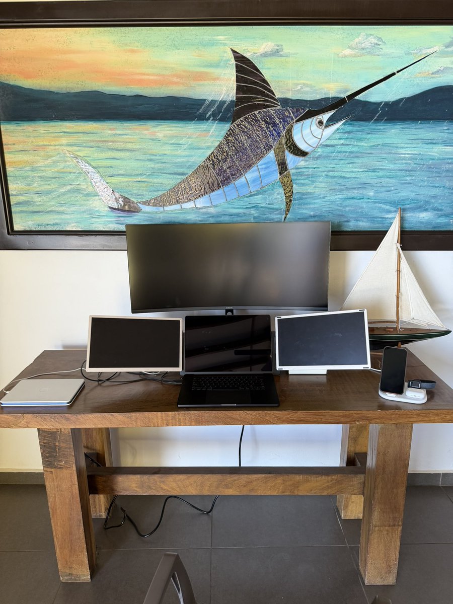 Multi-monitor AI studio desk