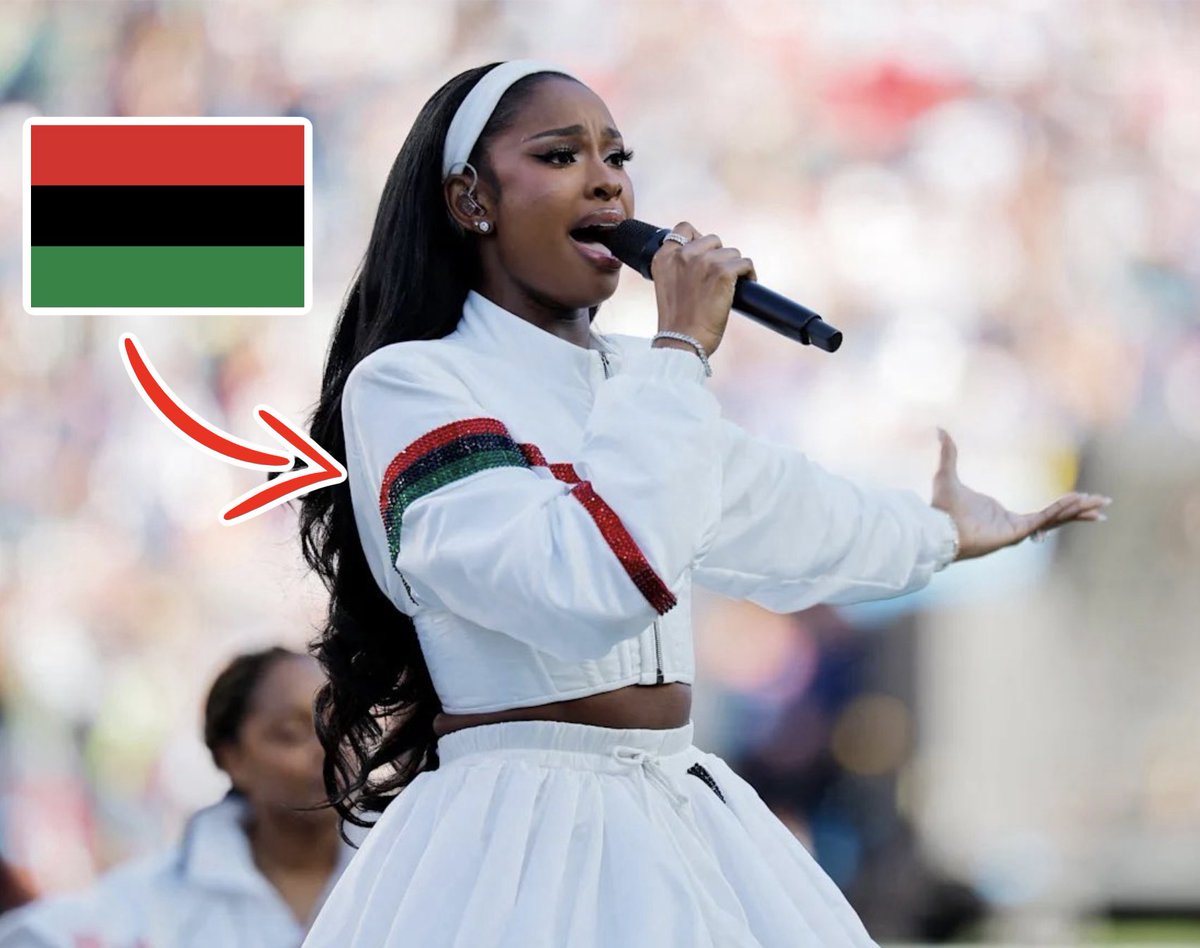 EndWokeness's tweet photo. Coco Jones was wearing an armband of the black nationalist flag at the "black national anthem" https://t.co/HX86idtfcA