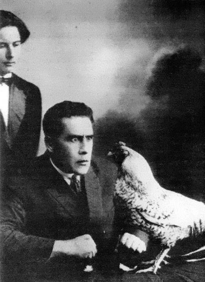Soviet poet, body-builder &amp; futurist Vladimir Goltzschmidt hypnotizing a chicken, 1930s