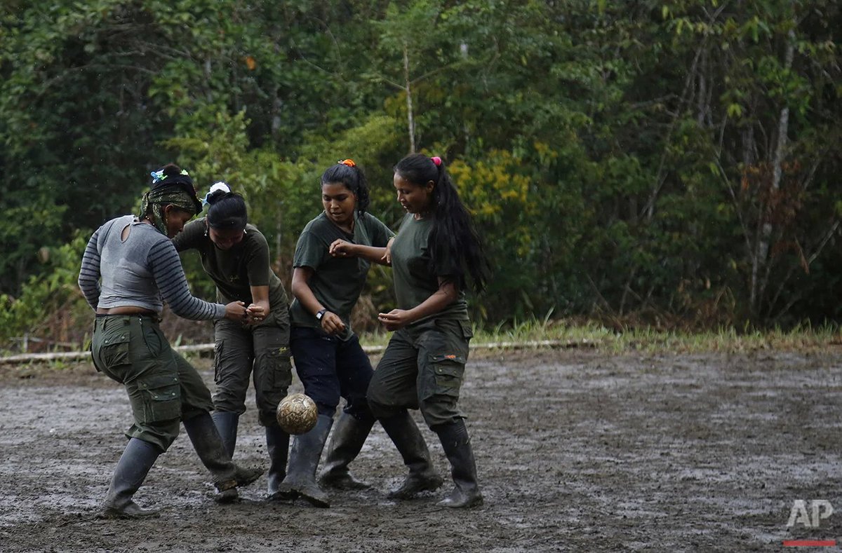 Women guerrillas (FARC) playing a football match at a camp in Colombia.