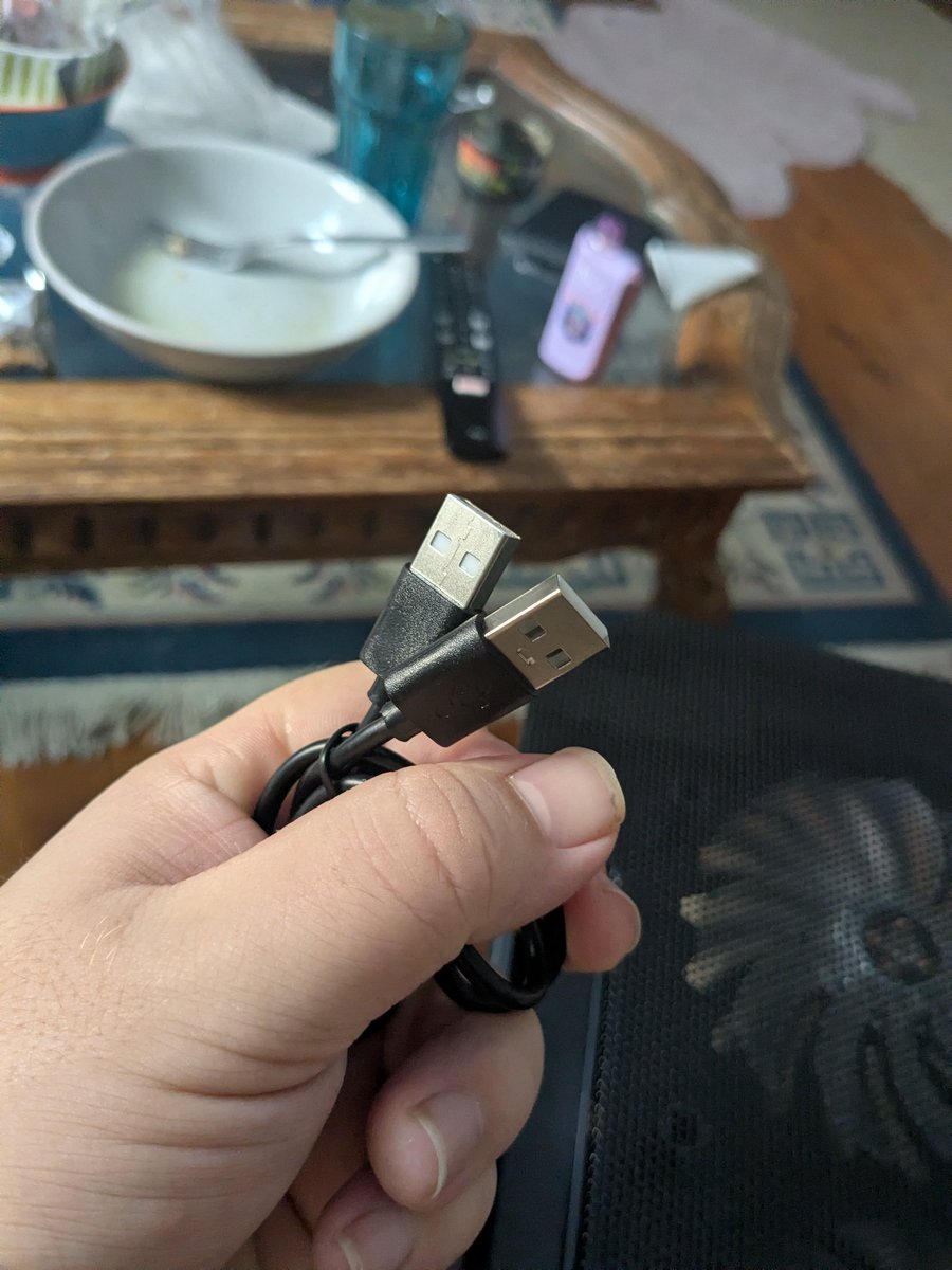 glackm8's tweet photo. My laptop cooling pad came with a USB A to A cable, this feels illegal https://t.co/ORAJALVtOk