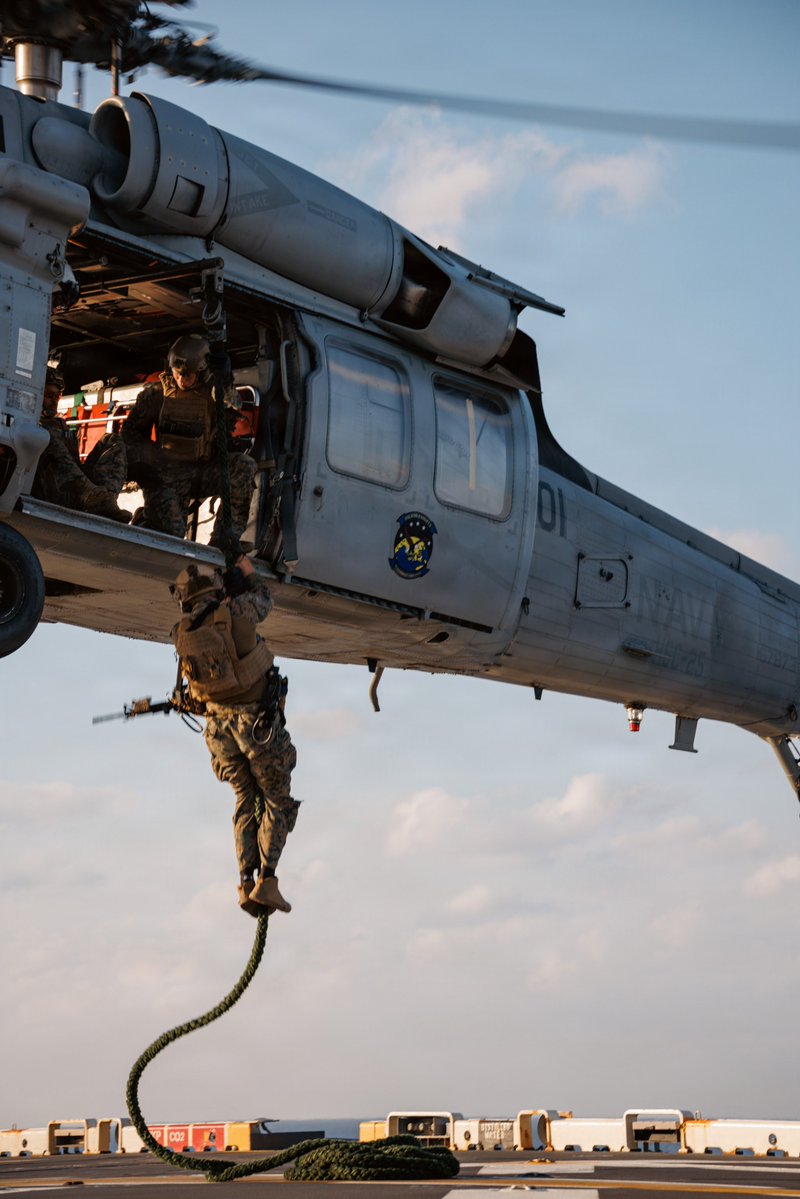 PacificMarines's tweet photo. Because Ladders are for #Amateurs! 🪢🚁
#PacificMarines and @USNavy MH-60S #Knighthawks execute fast-roping training in the Philippine Sea, Jan. 30, 2026.
📸by Lance Cpl. Victor Gurrola | @USMC https://t.co/u981vmIuIj