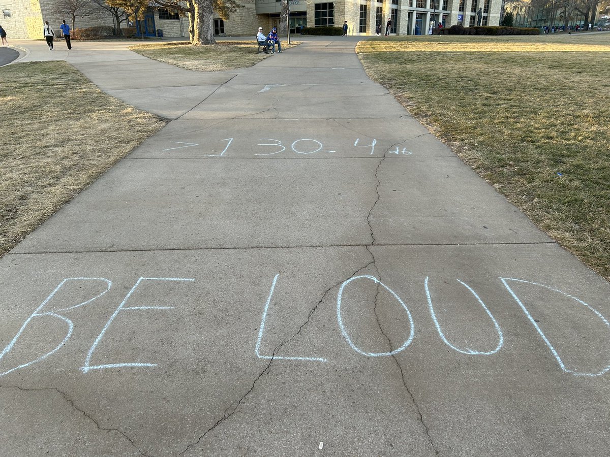 sam_winton2's tweet photo. A message on the sidewalk leading up to Allen Fieldhouse:

“130.4 db. BE LOUD” https://t.co/10Pz8O0lFq