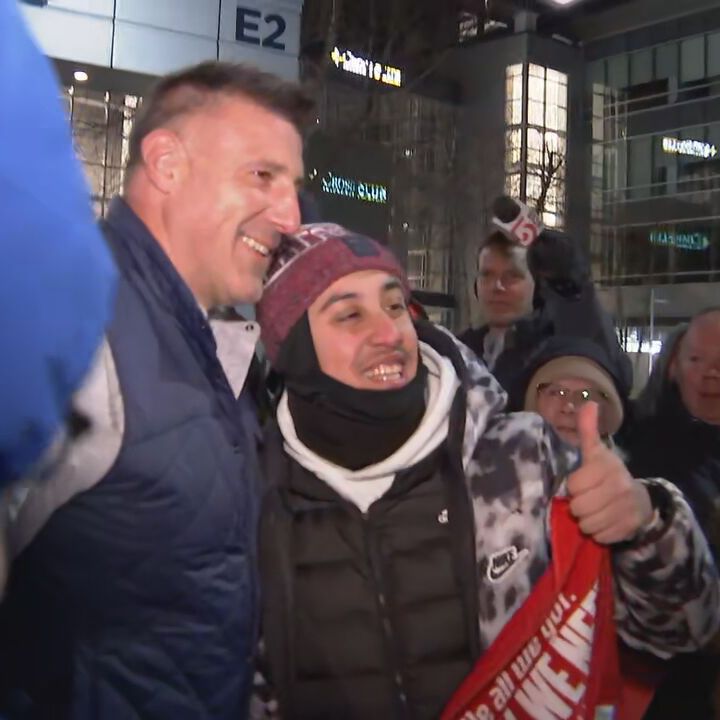 Head coach of the New England Patriots Mike Vrabel stopped to thanks fans in the cold as he arrived back to Gillette Stadium following a tough loss to the Seattle Seahawks in Super Bowl LX.