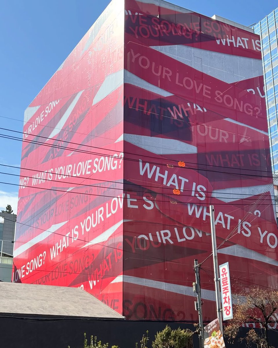 Billboards have popped up around the world asking WHAT IS YOUR LOVE SONG?