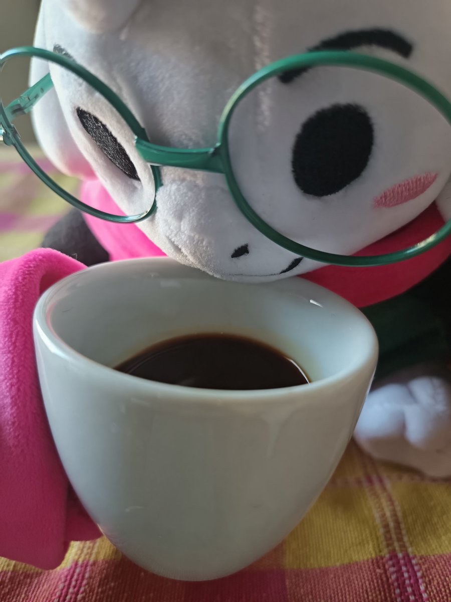 Fluffy boy drinking coffee