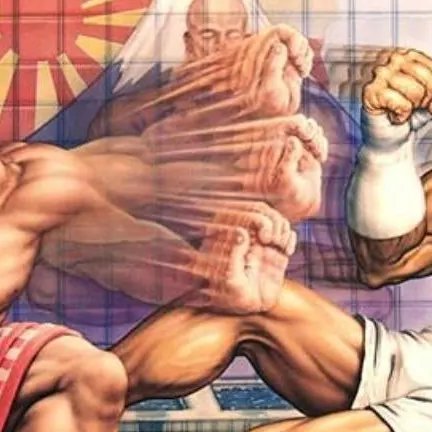 I was today years old..

Did you know Dhalsim is in the background cover art of the USA Version of Street Fighter II Turbo? 

Artist Mick McGinty's clean original art shows him clearly teleporting behing Honda and Sagat, but he was obscured on the final box by the title logo