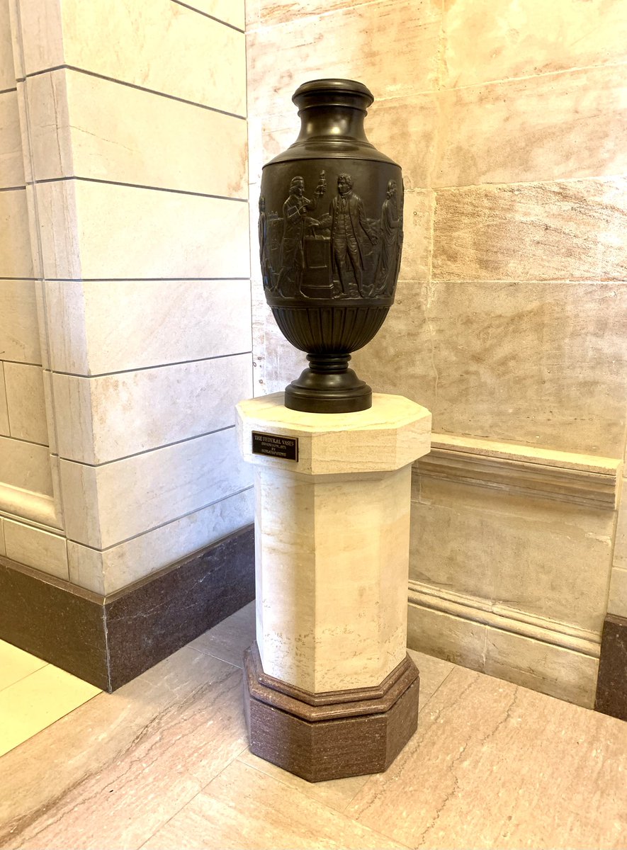 This bronze vase, entitled “Invention,” is located in the U.S. Capitol and was made in 1871. In this vase, Freedom is personified by a male figure wearing a liberty cap. Also shown on the vase are three leading Americans: Benjamin Franklin, Robert Fulton, and Samuel F. B. Morse.