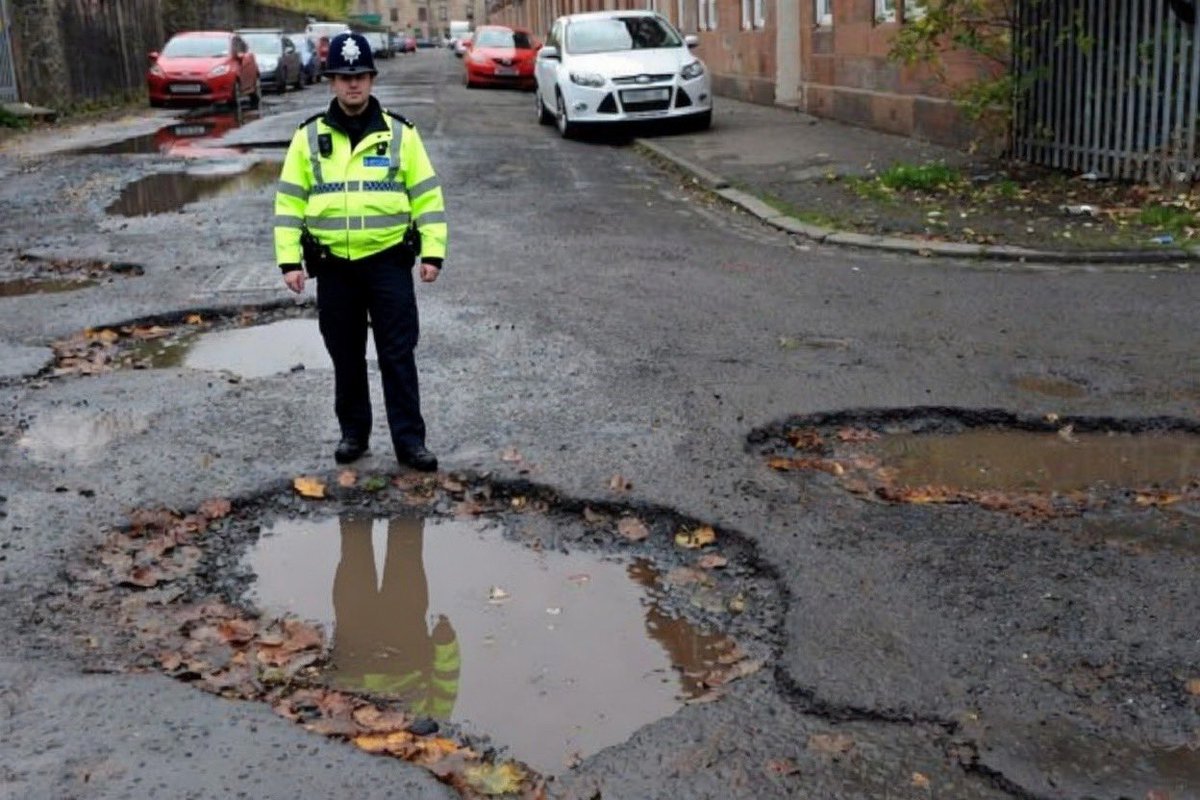 The police can FINE you up to £10,000 and 3 points on your license for having bald or minimum tread on your tyres if they find you driving an unroadworthy vehicle.  

Should the police be able to FINE local councils for unroadworthy roads with potholes?