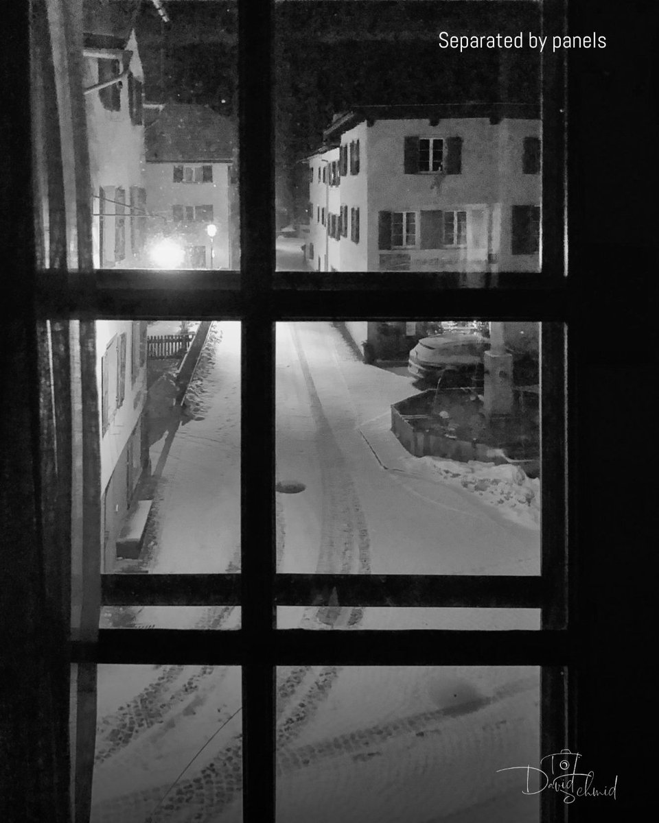 dschmidphoto's tweet image. Seen through glass, the outside world feels distant and contained. The window divides the scene into measured sections, fragmenting streets, light, and snow into quiet panels. ❄️

#BlackAndWhitePhotography #NightPhotography #WindowFrames