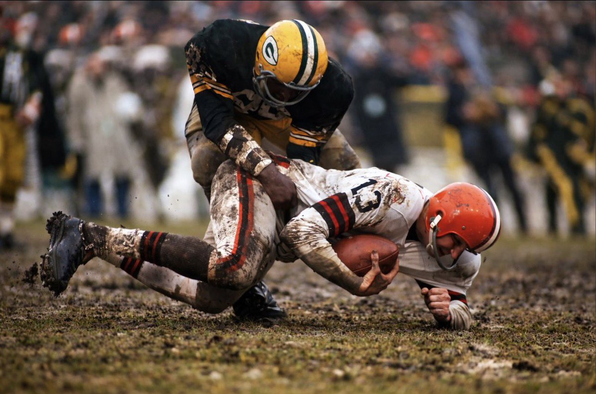 The Packer’s Lionel Aldridge takes down Cleveland QB Frank Ryan in da mud in 1966… #Packers
