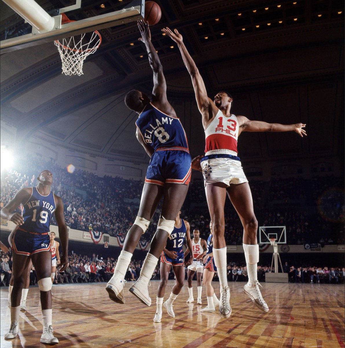 Walt Bellamy maybe gets a fingertip on this Wilt finger roll in the mid 60s. Willis Reed (19), Dick Barnett (12), Dick Van Arsdale (5) and Hal Greer (15) look on