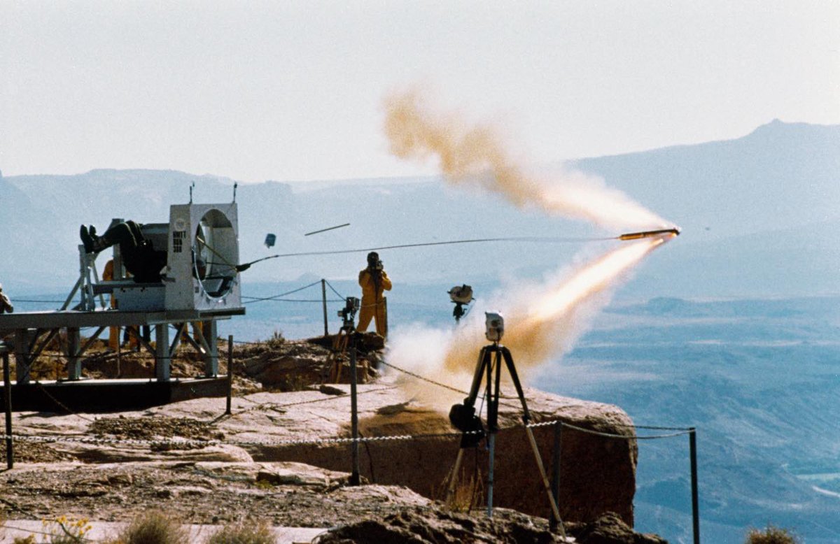 Boneyardsafari's tweet image. Here is the shuttle crew escape systems (CES) tractor rocket test that was conducted at Hurricane Mesa, Utah in 1987. It was a preliminary ground test of the tractor rocket that was followed with in-air evaluations. The tractor rocket was fired from side hatch mockup #ces
