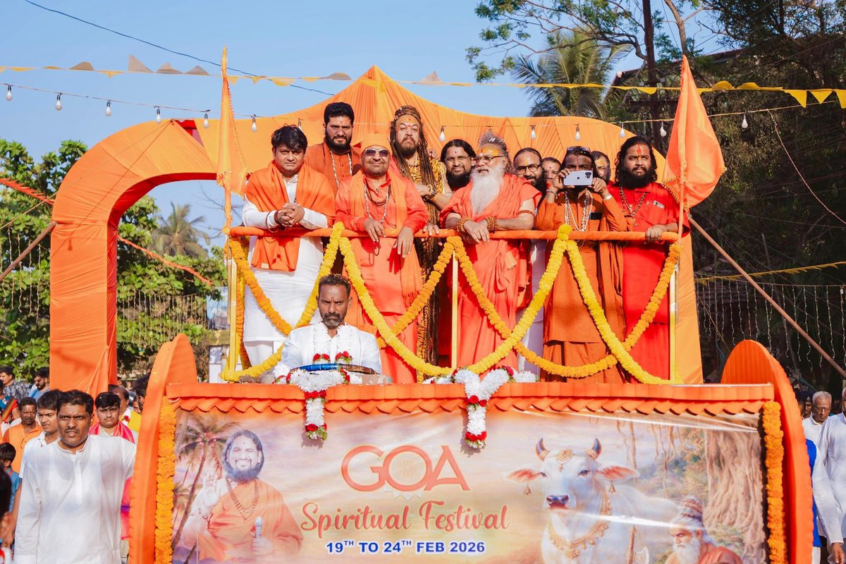 ISpiritualFest's tweet photo. A vibrant procession in the sacred presence of revered saints and mahants at Goa Spiritual Festival 2026, Calangute — the thunder of dhol-tasha, the resounding gajar, hearts filled with joy, and saffron devotion shining everywhere. https://t.co/LxhbWab9JA