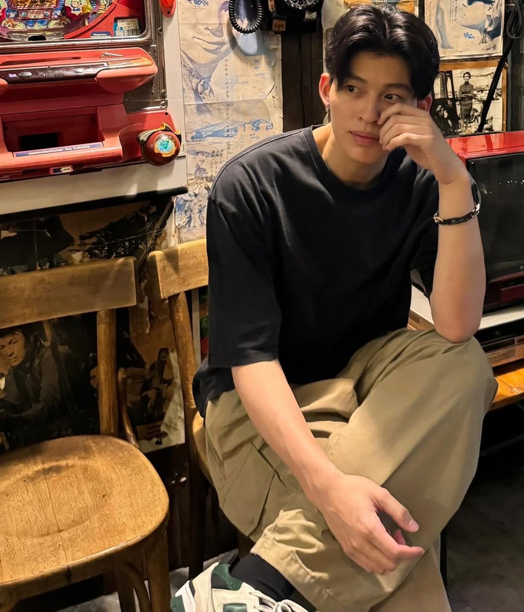 Black shirt, sharp gaze, timeless room 🖤