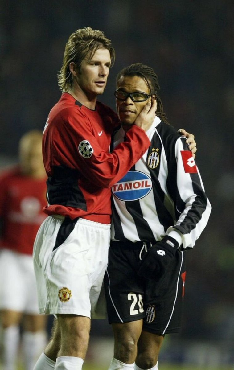 Who's the player beside Beckham?

Level: HARD