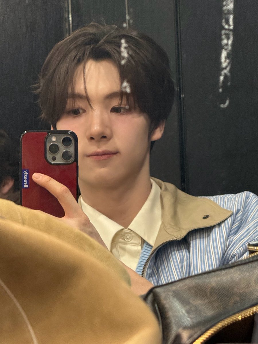 waiting in the makeup chair like it’s a full-time job, then sneaking a mirror selfie when no one’s looking. blue fit, calm face, brain still running on caffeine