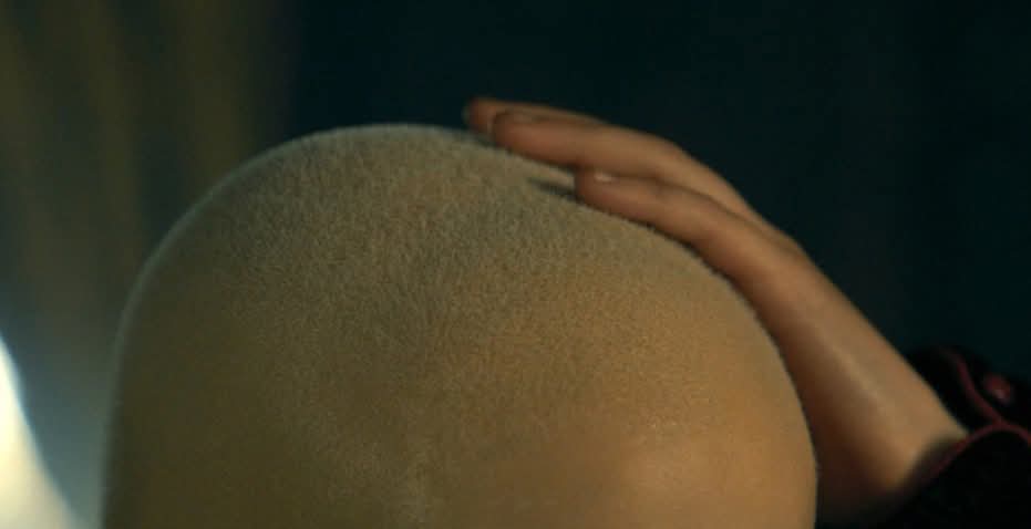 Me picking out a kiwi at the grocery store