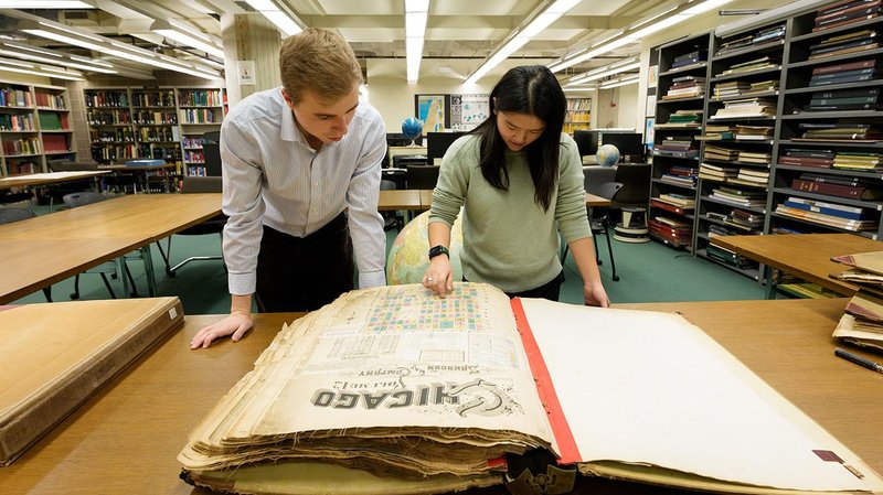 College students are working on a project at the Library to create searchable digital maps about the hidden history of Chicago's neighborhoods using century-old insurance atlases. Read more: lib.uchicago.edu/about/news/a-s… <a href="/UChicagoCollege/">UChicago College</a>