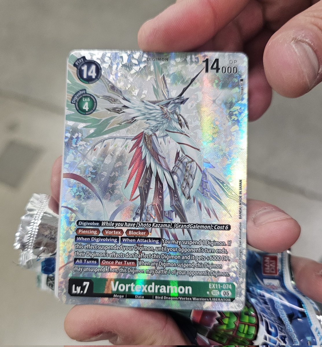 Crypta_Agate's tweet photo. Forgot to post this one here in addition to YouTube but last week my coworker bought a Digimon card pack during his break and he pulled this secret rare Vortexdramon!

Yes I am currently making plans to rob him...just kidding...or not.... https://t.co/TSDzFBvCqv