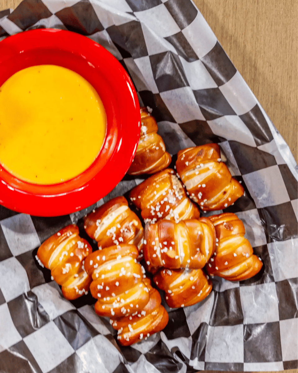 Dig into our Pretzel Bites with Warm Beer Cheese—fresh-baked, lightly buttered, and dusted with sea salt. Paired with our one-of-a-kind beer cheese, this is the snack dreams are made of. gaslightpizza.com