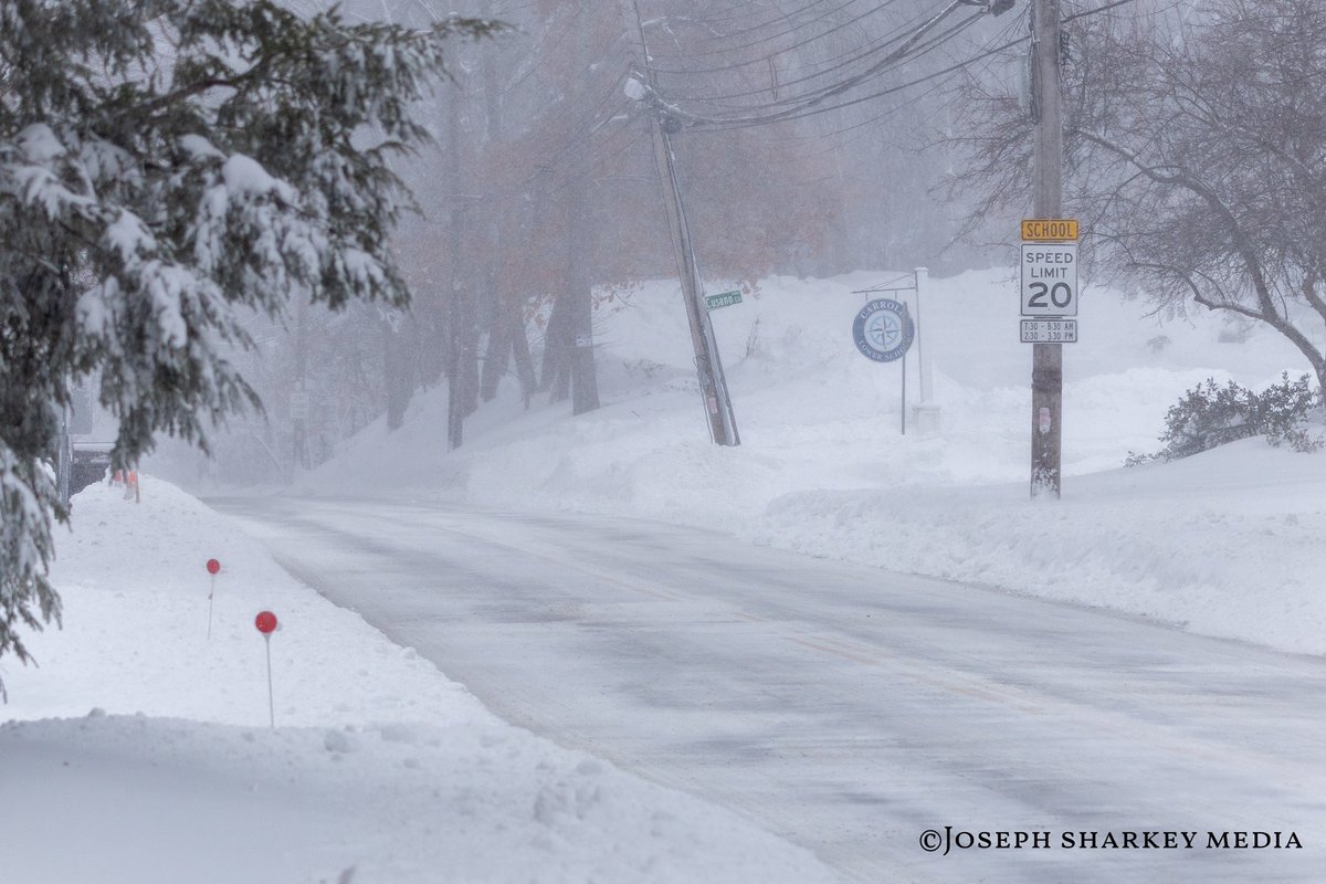 PhotoShark55's tweet photo. Waltham, MA - Blizzard conditions continue across Waltham as a powerful winter storm moves through eastern Massachusetts, bringing heavy snow and strong winds to the area. While main roadways have been cleared enough for limited travel, many side streets and residential roads remain snow covered and difficult to navigate. Blowing snow and drifting have reduced visibility at times and created slick, uneven road conditions.

Based on conditions observed throughout the city, Waltham has seen roughly a foot to a foot and a half of snow, with deeper accumulations and drifts in less traveled areas. As shown in the photos, vehicles have become disabled on untreated streets, and traction remains an issue in neighborhoods where plows are still working their way through.

Plow crews and emergency services continue to respond across the city, focusing on keeping main routes open while gradually clearing secondary roads. Drivers are urged to use caution, avoid unnecessary travel, and be aware that conditions can change quickly depending on snowfall rates and wind. Residents are encouraged to remain alert and give plow operators room to work as cleanup efforts continue.