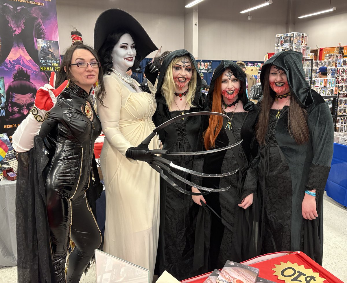 A whole slew of dangerous video game women at #albuquerque #comiccon 2026. #cosplay #bayonetta #REVillage