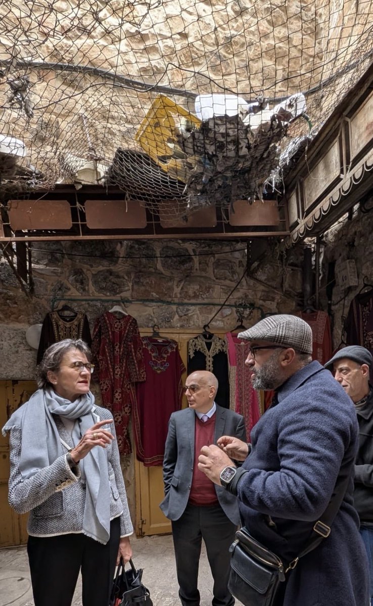 Notice the giant pile of garbage above their heads? Palestinian residents had to put up nets because Israeli settlers living in apartments throw garbage on the people below them. Also reports of settlers throwing excrement and acid on people, all with the protection of the IDF