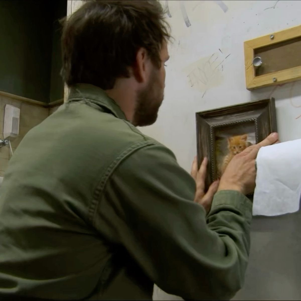 the concept of charlie having emergency framed cat photos