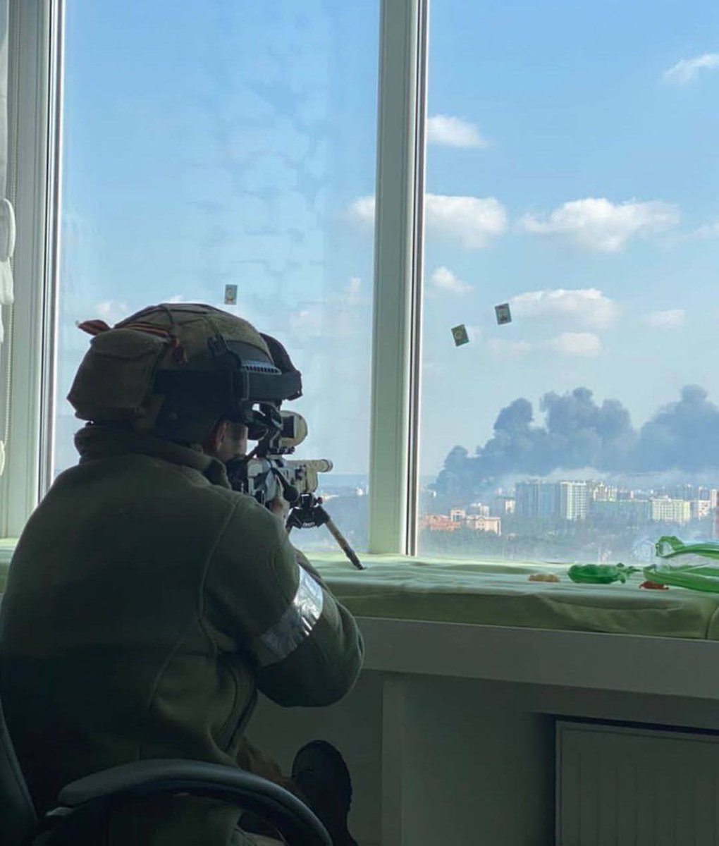 clashreport's tweet photo. 📸 Russian sniper observes the outskirts of Kyiv from the town of Irpin, early March 2022.

At that time, the Ukrainian capital was just within reach. https://t.co/79I551Dy18