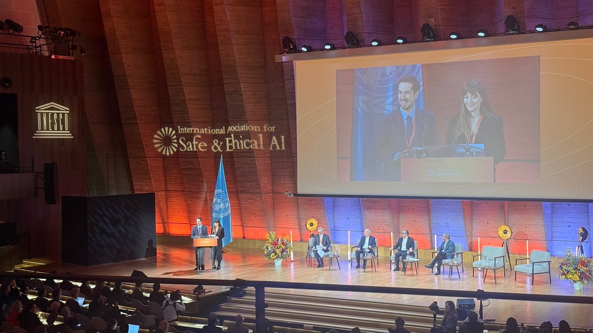 Dr_Atoosa's tweet photo. I’m thrilled for the opportunity to share the stage this morning at the @UNESCO  House in Paris with the wonderful program co-organizers Stuart Russell and Mark Nitzberg. Along with my wonderful colleague and friend, Jaime Fernández Fisac, we provided opening remarks about the truly interdisciplinary program we curated for this year’s conference hosted by the Association for Safe and Ethical AI (IASEAI). #AI is a transformative and consequential technology, and it should be up to all of us — not just a few — to decide where it takes humanity.