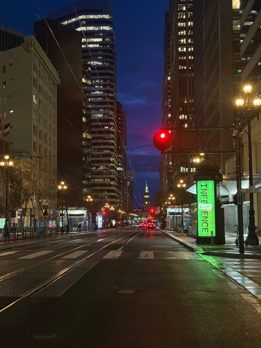 lillysharples's tweet photo. It's 6am and the city is still deciding whether to be night or morning. We drive past office buildings with their lights already on, and I can't tell if those people never left or just couldn't wait to get back.

I'm in a Robotaxi, talking to the support driver about how we make room in the world for things that aren't quite human. The irony sits between us quietly.

I'm on my way to the office, because I'm too excited to sleep.

The thing nobody tells you is how ordinary it feels. You're living inside something enormous and it just feels like being busy. Every day something drops that makes yesterday feel slightly outdated. The pace isn't normal. The conversations aren't normal. Even the commute isn't normal.

Nobody warned me the future would just show up, quietly, on a Tuesday. I did not expect to feel it this viscerally, this fast, in a car with no driver.

And yet here we are, discussing social problems that didn't exist five years ago, on the way to work on problems that didn't exist last week.

Somewhere a very normal Tuesday is happening. Not in San Francisco.