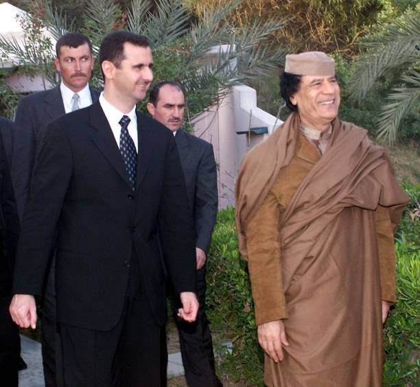 25YearsAgoLive's tweet photo. Syrian President Bashar al-Assad visits Libyan dictator Muammar Gaddafi in Tripoli.

Assad is on his first trip to Africa since taking power last year. https://t.co/o9PsnfpcUZ