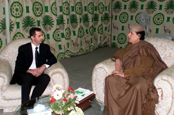 25YearsAgoLive's tweet photo. Syrian President Bashar al-Assad visits Libyan dictator Muammar Gaddafi in Tripoli.

Assad is on his first trip to Africa since taking power last year. https://t.co/o9PsnfpcUZ