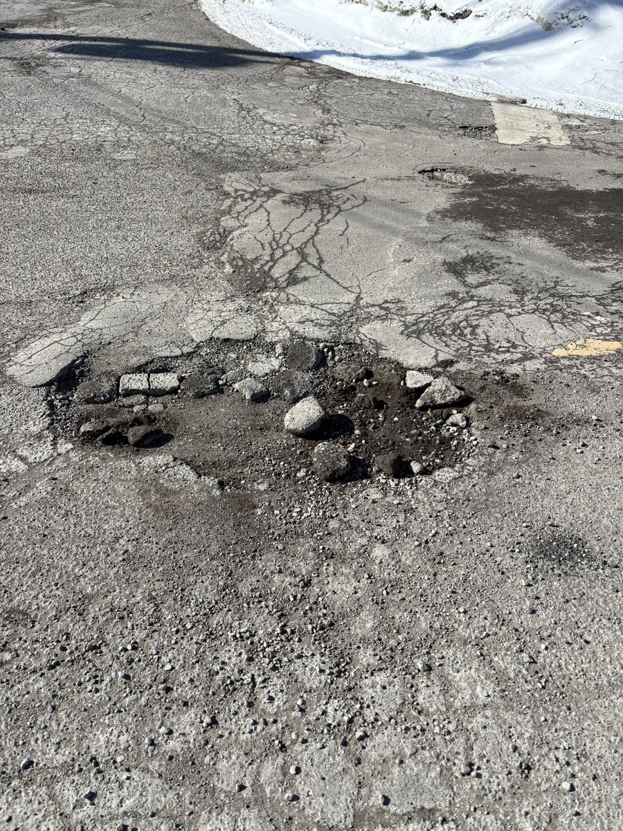 Beth_Levy66's tweet image. Just a few of the potholes on my walk today. They get filled every year. This is not a sustainable solution. It’s barely even a bandaid. #TOpoli