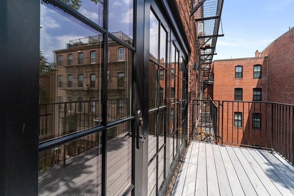 In the South End, stepping out your own door for a breath of fresh air is the ultimate luxury. 

A small space requires "Surgical" design. • Built-in seating to hide HVAC. • Vertical planters to save floor space. • Flawless water management.
Small footprint. Massive impact.