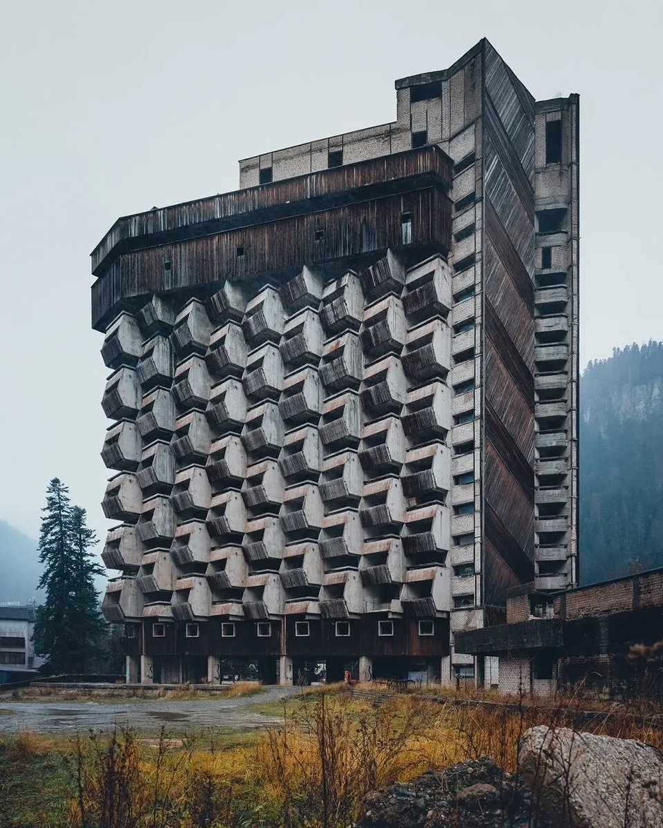 In the USSR, concrete was the material of the future. 

It was cheap, durable, and allowed for massive, gravity-defying shapes that suggested the Soviet Union was leaping into the Space Age. 

Unlike the ornate "Stalinist Empire" style that came before it, Brutalism was about raw