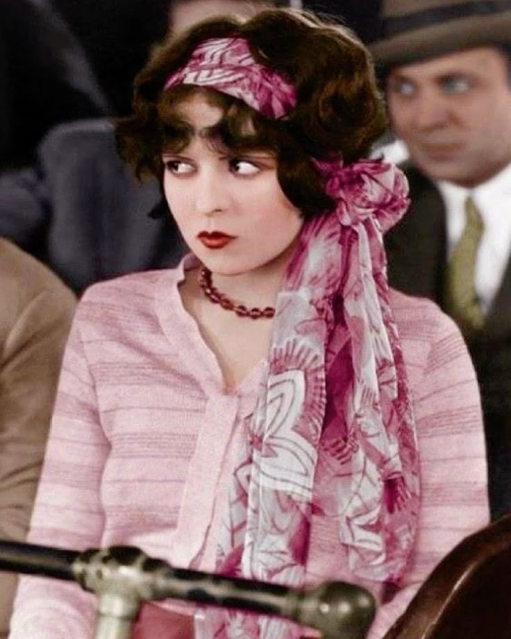 this colorized picture of clara bow fucks me up bc this could literally be any girl off tiktok today