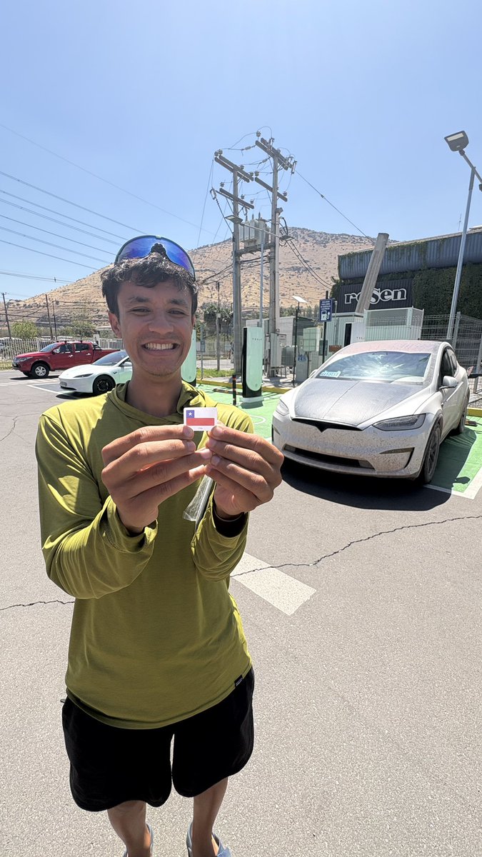 Everydaysandro's tweet photo. Tesla has 2 Supercharger Locations Open in South America. I decided to see if I could charge my North American Model X, Beluga, with NACS in Santiago Chile. This is what I learned…

To get here, I drove 34,300 Kilometers (21,437 miles) across 13 countries through some of the most beautiful, remote, and dangerous areas in the world. 

I have a special NACS to CCS2 adapter, which I have used all over Latin America, but what  I was worried about, was that the car UI maps are North American, meaning the chargers do NOT register in the UI..

First attempt - Fail. 

Then Jimmy said, keep trying by pressing the button. Keep going…

Second attempt - Click, Click. I saw the Tesla logo blinking GREEN! 

We were charging, at 180kW, the fastest charge  I have had in all the Americas. WILD! 

Remember, some places I have averaging 3amps…1kW if I was lucky! 

Then, once the charge was done, from 38% to 80% SoC, taking about 25 minutes, I got the error that my credit card could not be used to pay for the charging, meaning I could potentially be locked out.. I reentered by credit card, and magic, I paid for the charging! 

$10,900 Pesos - $12.67 
$300 Pesos kWh - $0.35

WHOAAAA. I was speechless…a kid, running around the car, so happy! High on life! 

I then made Jimmy, my friend traveling with me for the next few weeks, make it official, by placing the Chilean Flag underneath Belugas hood and signing his name and date to register the moment! 

A few hours later we drove to the Tesla store in Santiago, and explained about my expedition! 

The love I received and charger received will be shared in another post! 

@Tesla @Tesla_LatAm @ohjimme