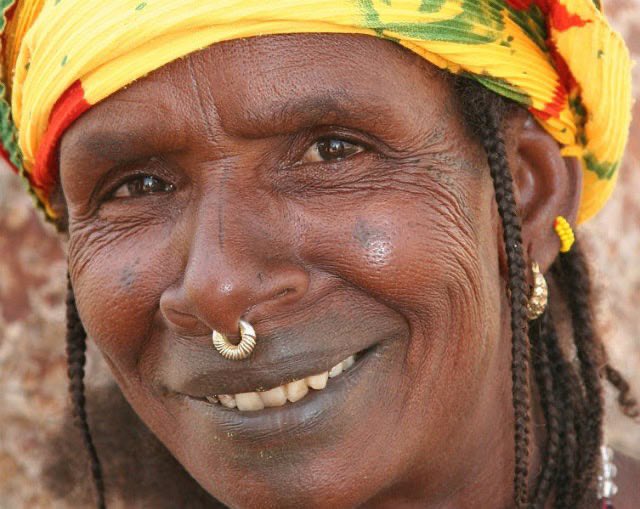 Africa’s got some wild customs that might seem odd at first glance, but they’re rooted deep in culture and history. 
The Fulani spread across West Africa from Senegal to Nigeria,have this intense tradition of filing their teeth into sharp, pointy shapes. It’s not just for looks;