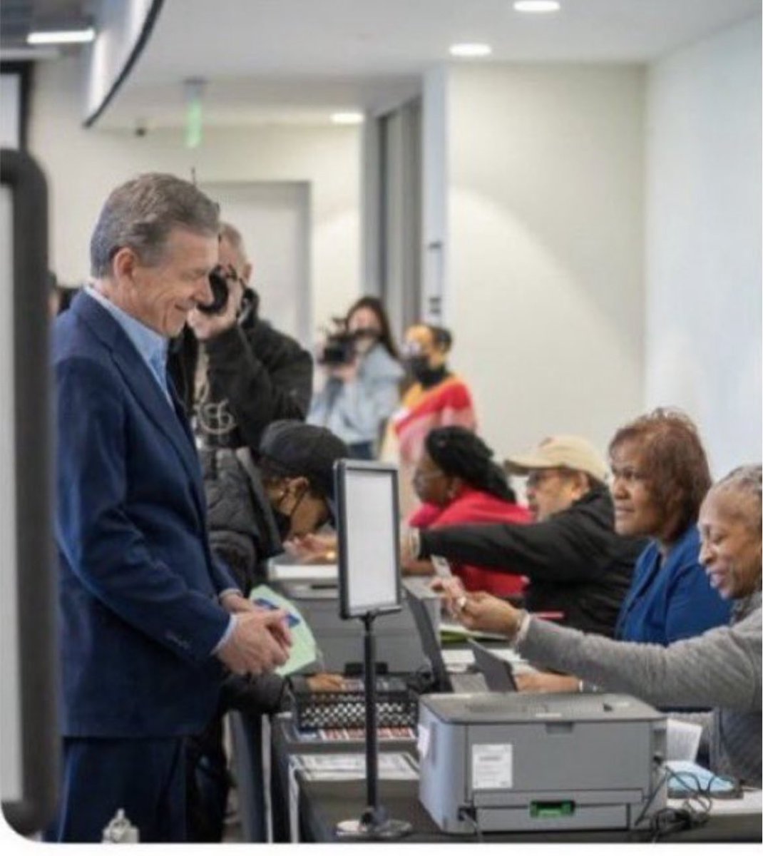 Showing a photo ID to vote: so easy even Governor Cooper can do it. (with a smile!)