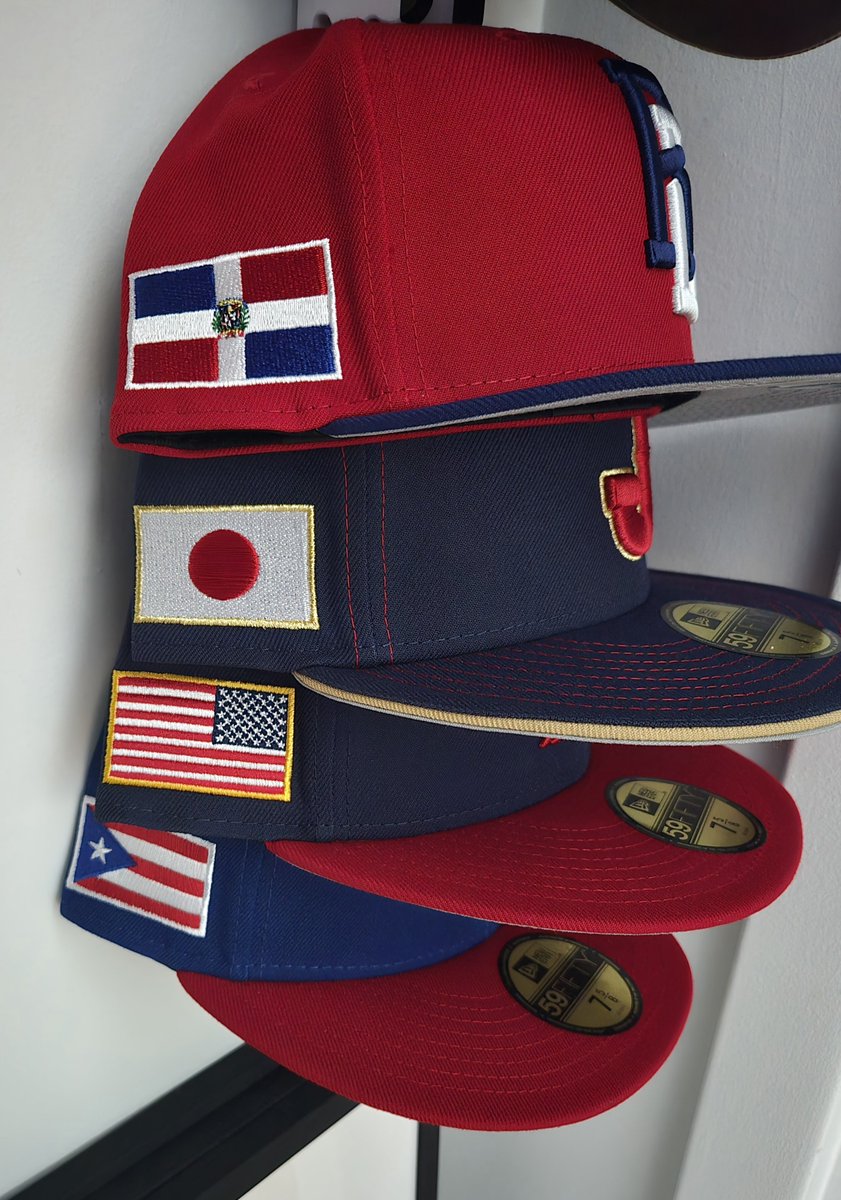 Ready for the WBC! Rooting for: Team USA for the obvious reason; DR for my favorite player, Japan for my third favorite player, and PR because, as I already said, rooting for Team USA. (And I'll remove all the silly stickers and curve the brims before I actually wear them...)