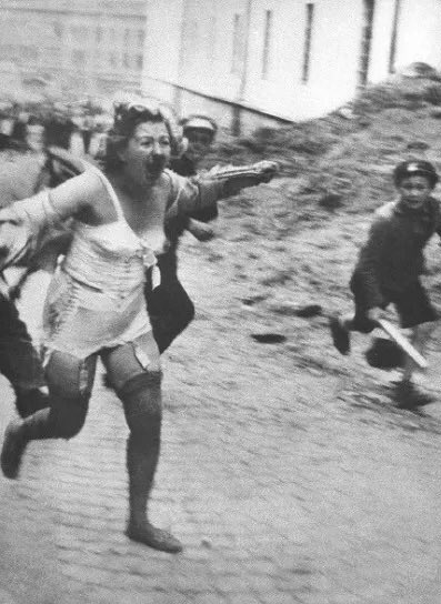RudiGeerts's tweet image. A Jewish woman being chased down the streets of the Lviv ghetto in Poland, where at least 6,000 Jews were murdered during a pogrom by militias and German forces (July 1941).