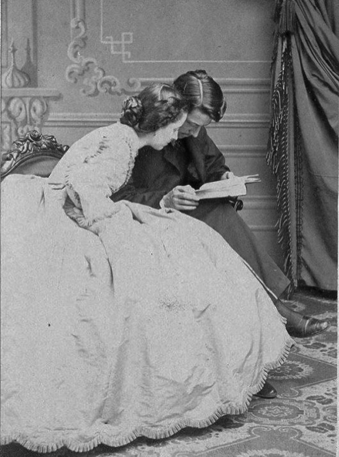 Portrait of a couple reading together. Photographed in 1864.