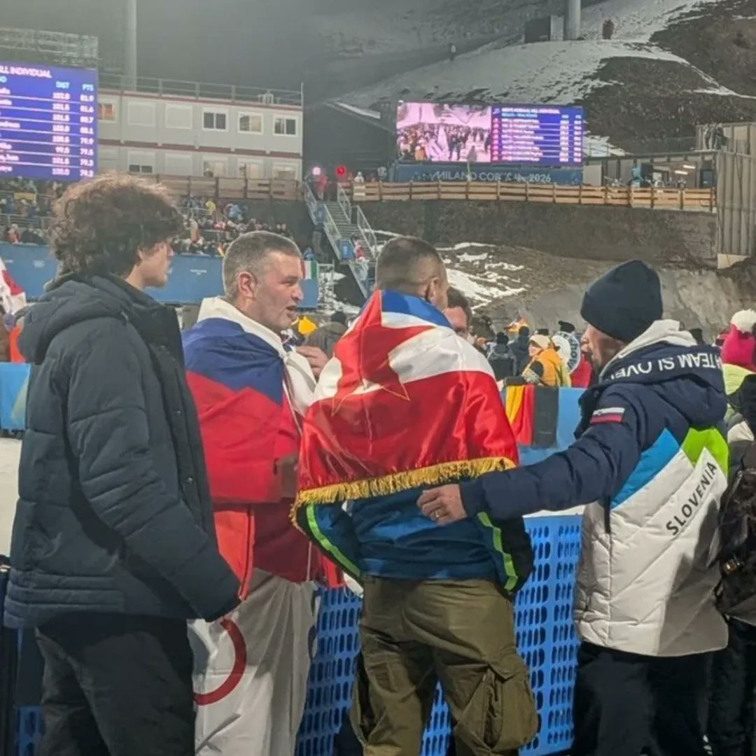 ultras_antifaa's tweet photo. Olympic champion cyclist Primož Roglič appears at the Winter Olympics in Milan with a companion carrying the Yugoslav flag. https://t.co/NnxfvIZTuz