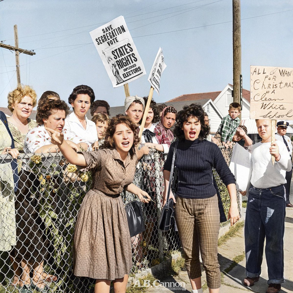 IndiaTales7's tweet photo. A crowd of angry parents hurl insults at 6 year-old Ruby Bridges as she enters a traditionally all-white school, the first black child to do so in the United States South, 1960. 

Bridges is still alive and is only 72 years old. https://t.co/ULU7Ks3BKV