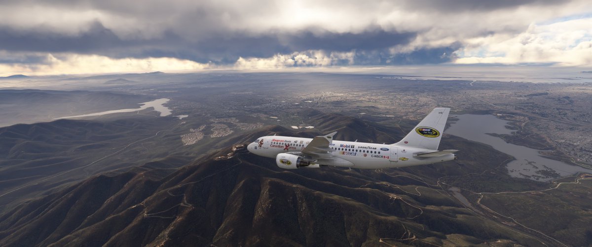 CXA001's tweet photo. 2/2 Photo dump from today's flight from Vancouver International (CYVR) to San Diego International (KSAN) 2 hours 38 minutes on @vatsim  with the @canadianxpress  NASCAR Livery Airbus A319-111. https://t.co/kkX5GvOOIo