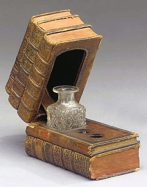 The French tooled leather-covered inkwell from approximately 1840.