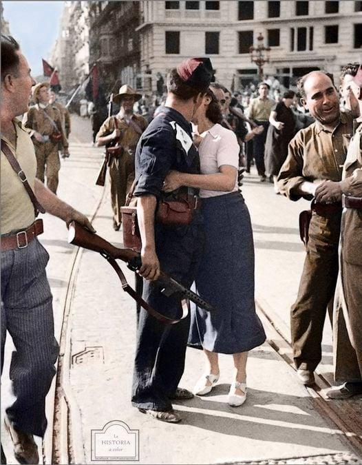 An anti-fascist partisan kissing their lover during the Spanish Civil War.