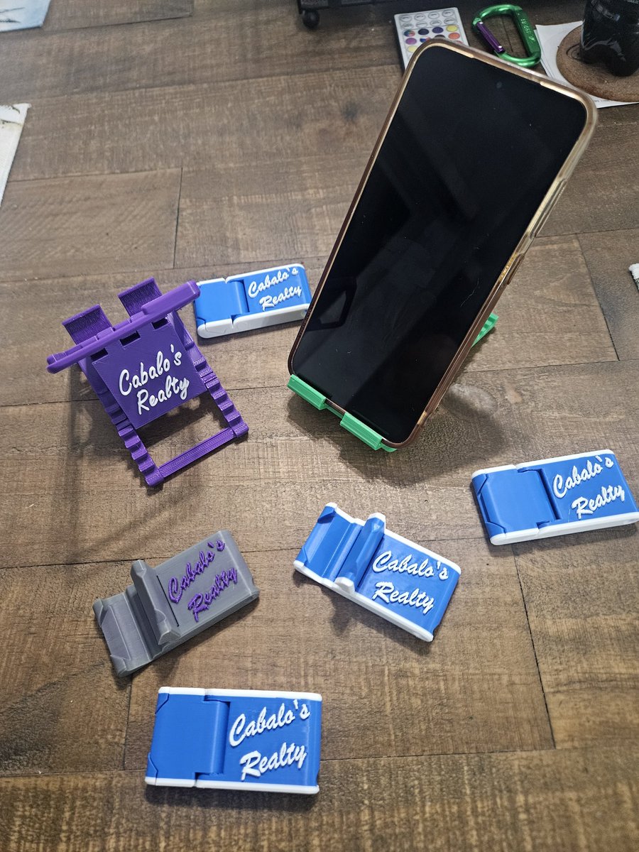RoyCabalo's tweet photo. Made more goodies for #cabalosrealty and our customers.  Who can't use a small folding phone stand!!! Just need the key chains to come in and make them in more colors or team colors!!! https://t.co/xX6o36yOnp